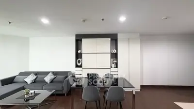 Modern living room with sleek furniture and elegant decor in a contemporary apartment.
