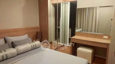 Cozy modern bedroom with wooden accents and mirrored wardrobe