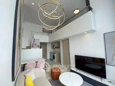 Modern duplex living room with stylish lighting and open kitchen layout