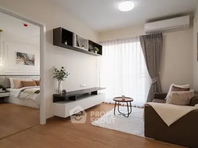 Modern living room with cozy seating and natural light, adjacent to a stylish bedroom.