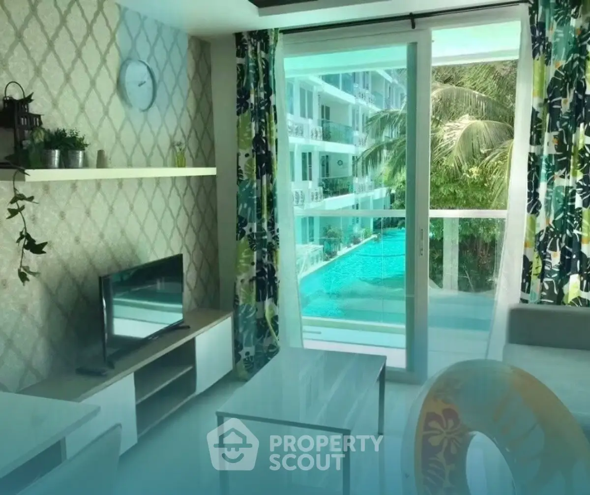 Modern living room with pool view and stylish decor in a luxury apartment.