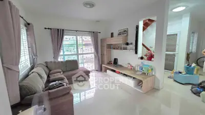 Cozy living room with sectional sofa and modern entertainment unit