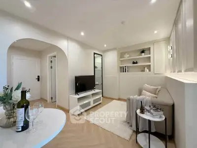 Modern living room with stylish decor and cozy seating area, perfect for relaxation and entertainment.