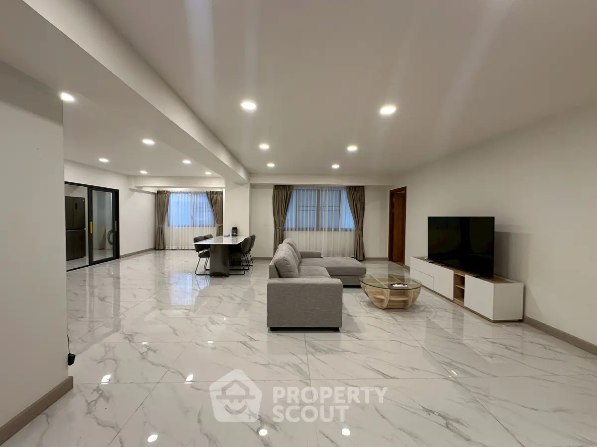 Spacious modern living room with elegant marble flooring and open layout