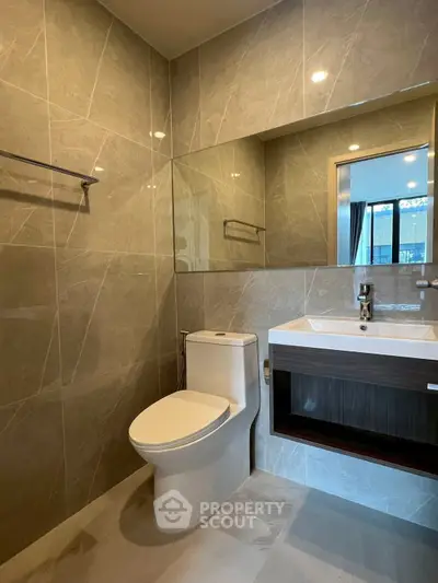 Modern bathroom with sleek fixtures and elegant tile design