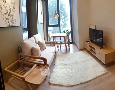 Charming living room with modern wooden furniture and large windows for natural light.