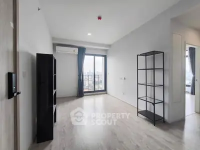 Spacious modern living room with city view and balcony access