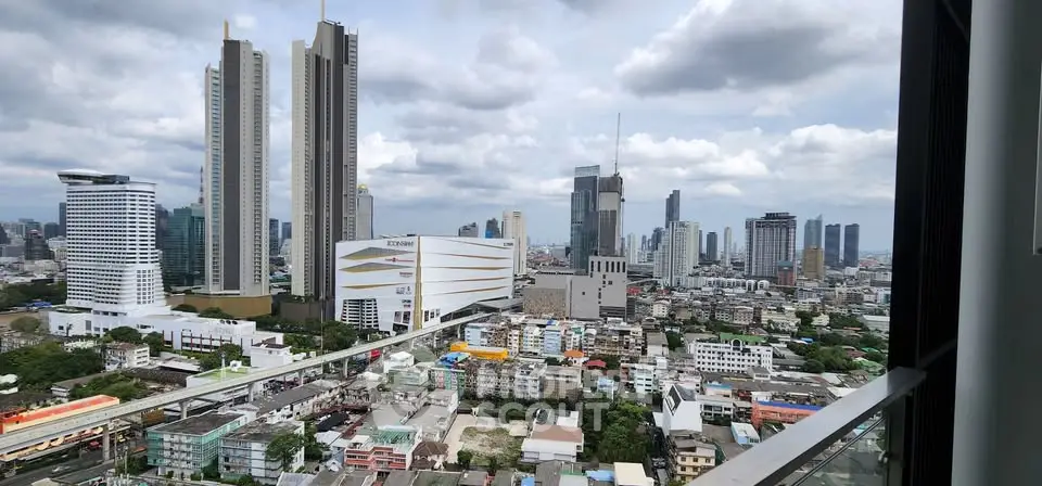 Stunning cityscape view from a high-rise balcony showcasing modern skyscrapers and urban landscape.