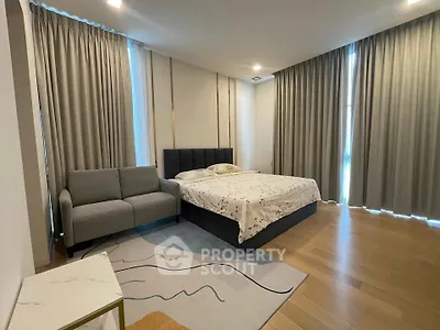 Spacious modern bedroom with elegant decor and natural light
