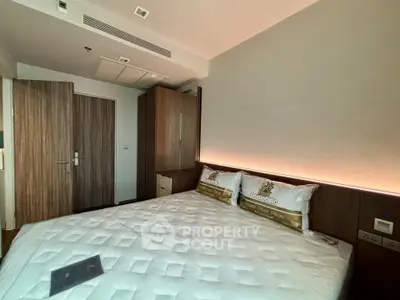 Modern bedroom with stylish wooden furniture and cozy lighting