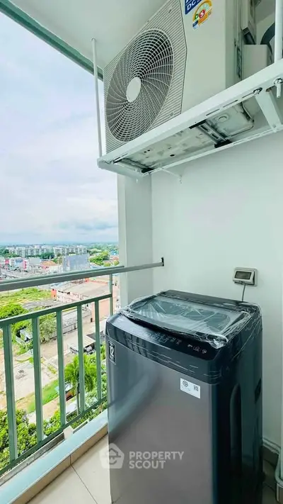 Modern balcony with washing machine and scenic city view, perfect for urban living convenience.