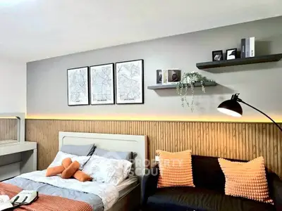 Modern bedroom with stylish decor and cozy seating area