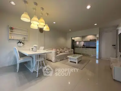 Spacious modern living room with elegant dining area and stylish lighting