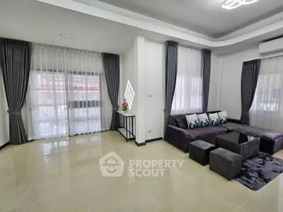 Spacious modern living room with elegant decor and ample natural light