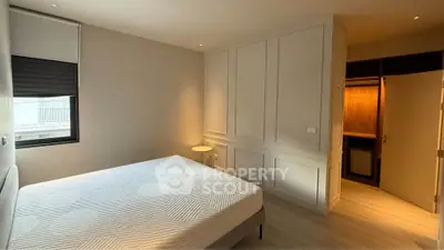 Spacious bedroom with modern design and ample natural light