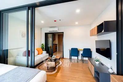 Modern living room with sleek furniture and open layout in a stylish apartment.