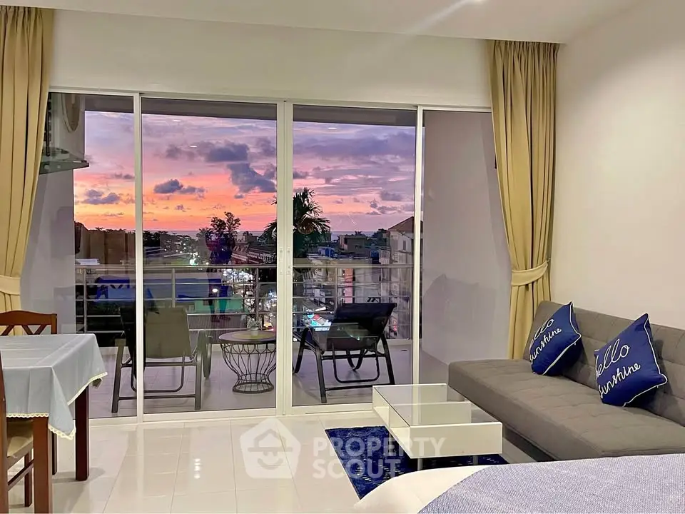 Chic living room with stunning sunset view from balcony in modern apartment