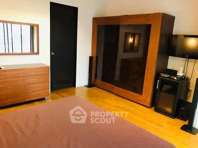 Spacious bedroom with modern wooden furniture and cozy ambiance