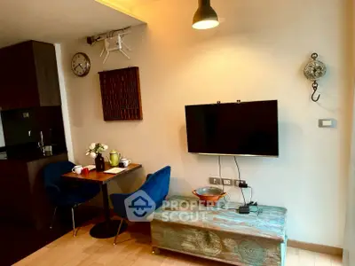 Cozy living room with modern decor and stylish furniture in a compact apartment.