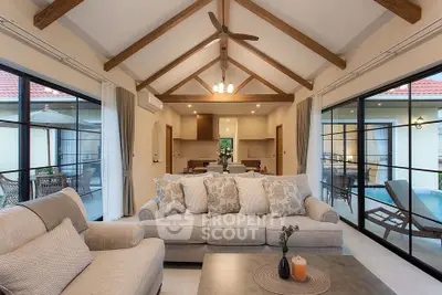 Spacious living room with vaulted ceiling and elegant decor