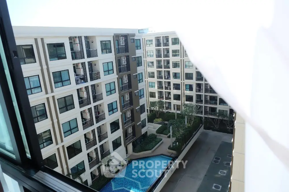 Modern apartment complex with swimming pool view from window