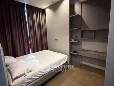 Modern bedroom with sleek design and ample storage space