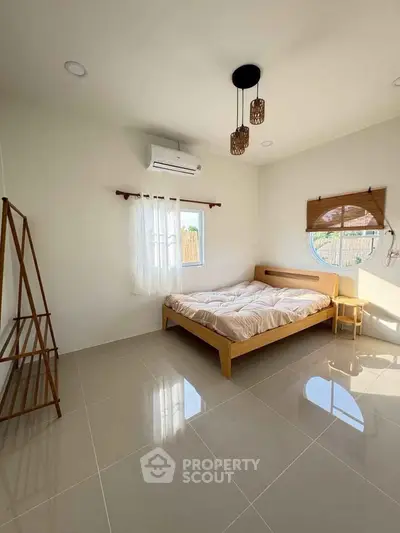 Bright minimalist bedroom with modern decor and natural light
