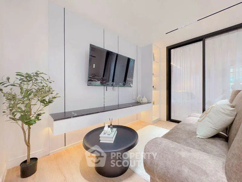 Modern living room with sleek design and wall-mounted TV