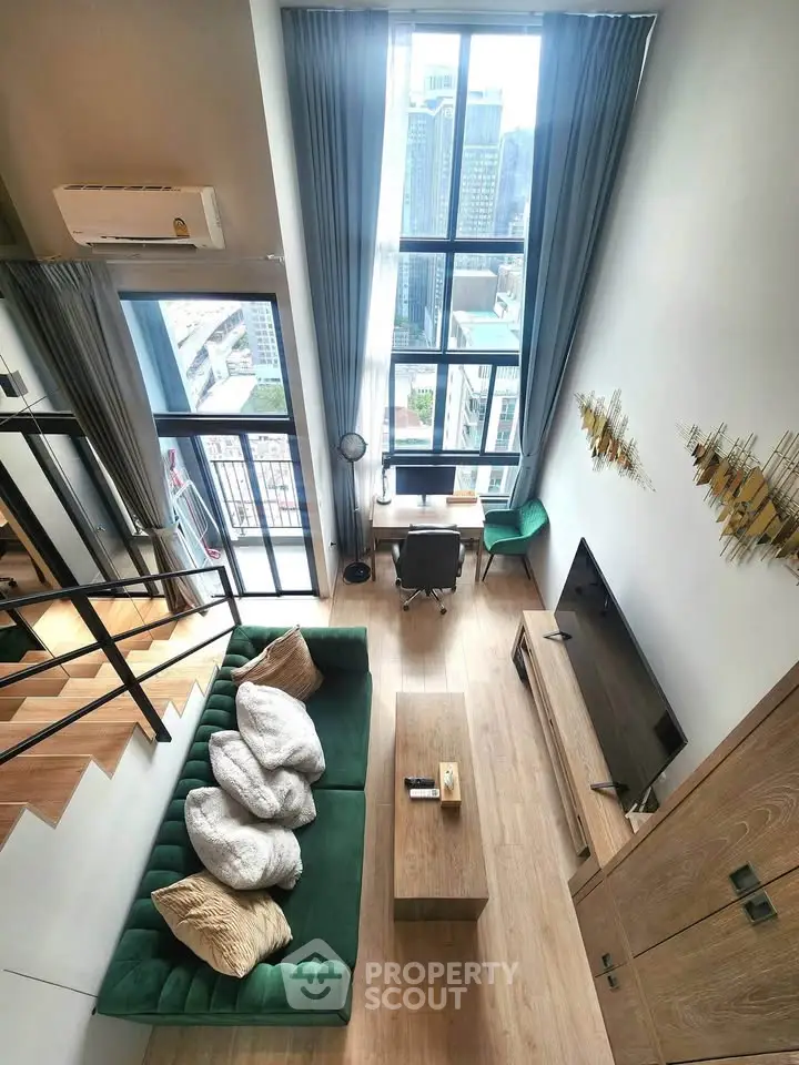 Stunning high-rise living room with floor-to-ceiling windows and modern decor, offering breathtaking city views.