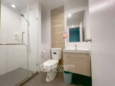 Modern bathroom with glass shower and sleek fixtures