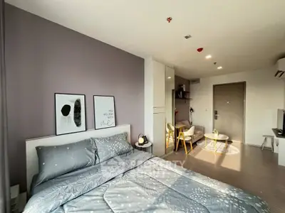 Modern bedroom with stylish decor and cozy ambiance in a contemporary apartment.