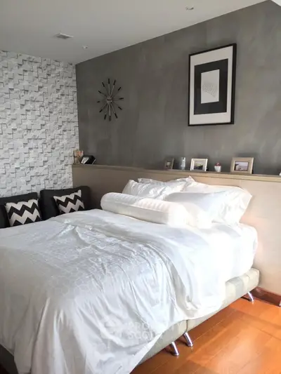 Modern bedroom with stylish decor and cozy bedding