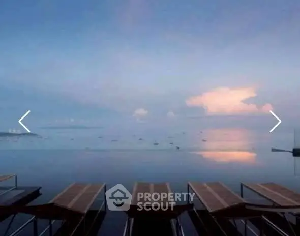 Stunning waterfront view with serene sunset over calm waters and docks.