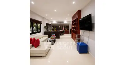 Spacious modern living room with elegant decor and large windows