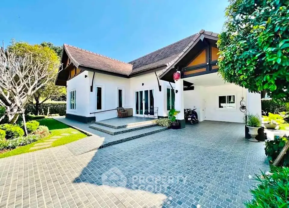 Charming single-story home with lush garden and spacious driveway, perfect for family living.