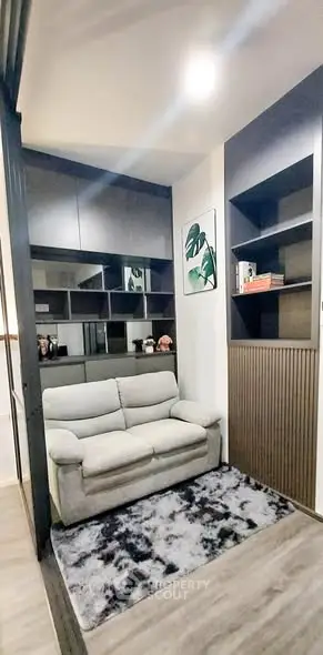 Cozy living room with modern shelving and plush sofa