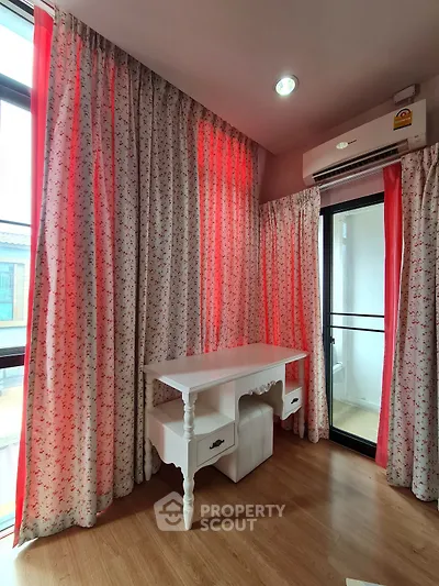 Charming study room with floral curtains and elegant white desk