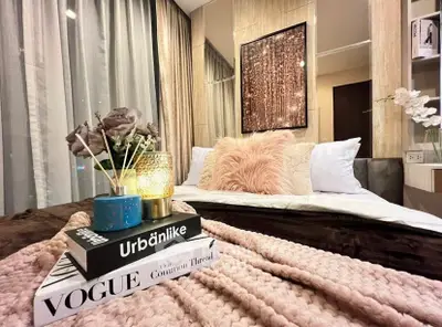 Luxurious bedroom with cozy decor and stylish accents, perfect for relaxation.