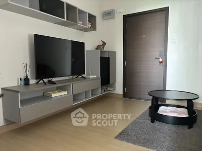 Modern living room with sleek TV setup and stylish furniture
