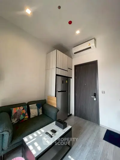 Modern living room with sleek furniture and air conditioning