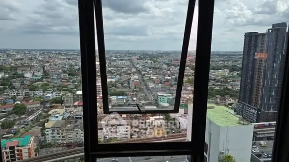 Stunning cityscape view from high-rise building window with expansive skyline.