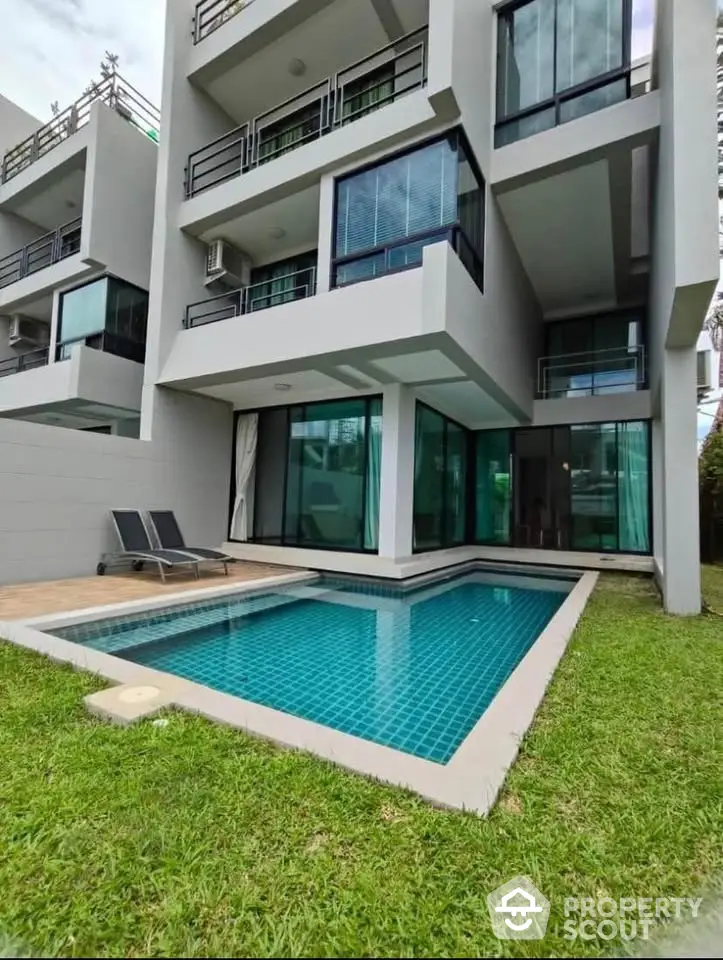 Modern townhouse with private pool and lush green lawn