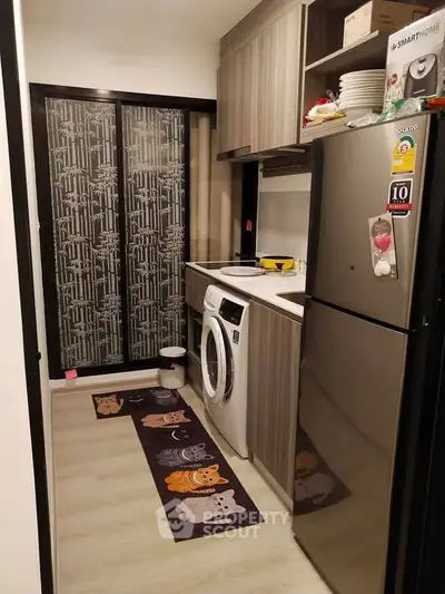 Compact kitchen with modern appliances and stylish cabinetry