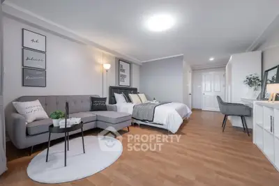 Spacious modern studio apartment with stylish decor and cozy living area.
