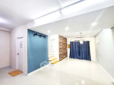 Spacious modern living room with stylish decor and elegant lighting, perfect for comfortable living.