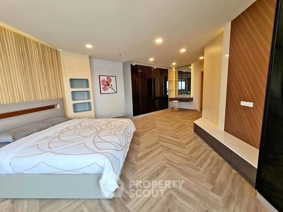 Spacious modern bedroom with elegant design and ample natural light