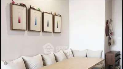 Cozy modern living room with stylish wall art and plush seating