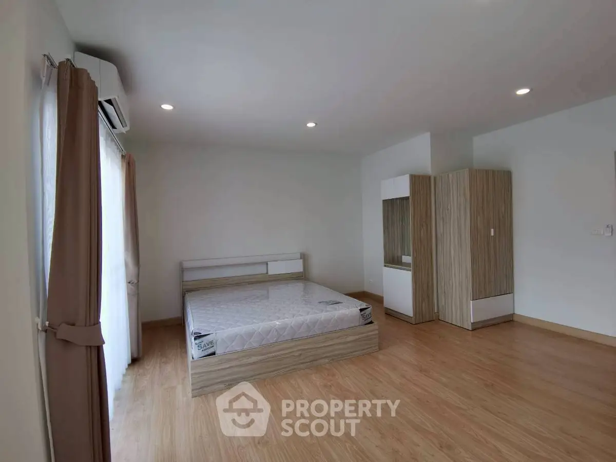 Spacious bedroom with modern design and natural light