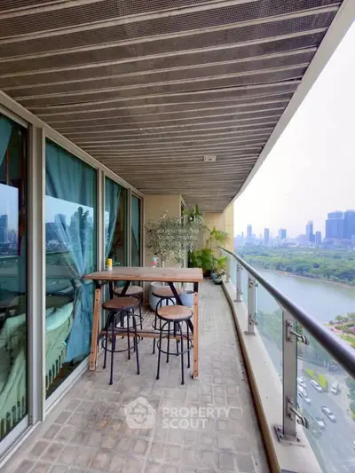 Spacious balcony with city skyline view, perfect for relaxation and outdoor dining.