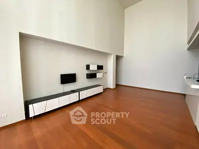 Spacious modern living room with high ceilings and wooden flooring